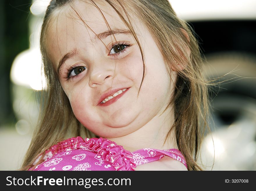 Beautiful brunette with big brown eyes showing her teeth looking sweet even with her hair a little messed up. Beautiful brunette with big brown eyes showing her teeth looking sweet even with her hair a little messed up.