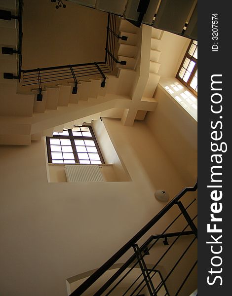 Perspective view at elegance shadowed staircase with windows
