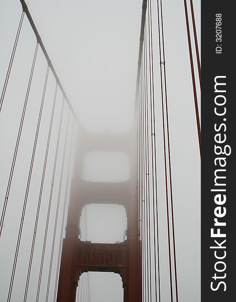 The Golden Gate Bridge encased in fog. The Golden Gate Bridge encased in fog