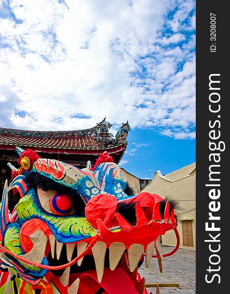 A puppet oriental dragon head with clear blue skies