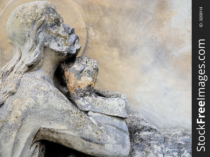 Old Jesus statue in cemetery