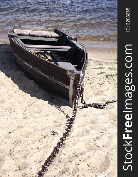 Old boat riveted by chain