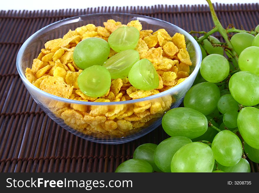 On diet - milk musli and grapes close-ups. On diet - milk musli and grapes close-ups