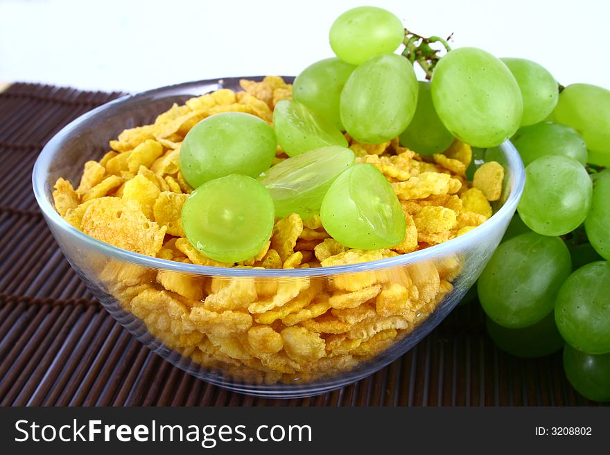 On diet - milk musli and grapes close-ups. On diet - milk musli and grapes close-ups