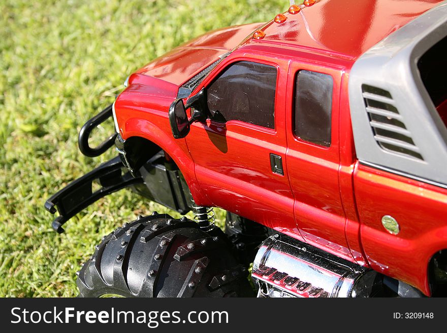 Red Toy car, radio controlled 4 x 4 scale vehicle