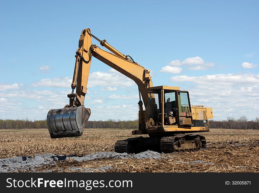 Excavator On Cultivated Land