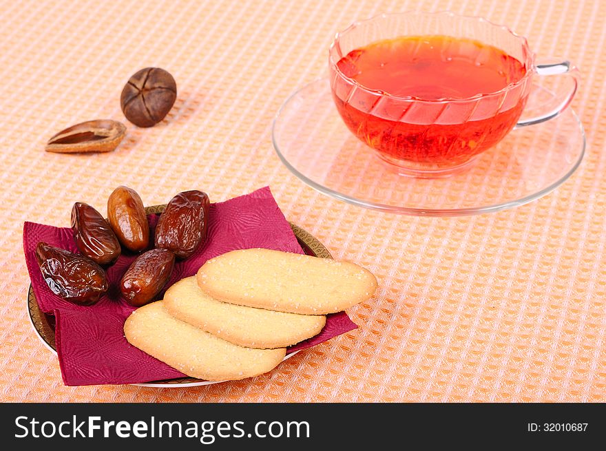 Black tea, cookies and dates for afternoon tea