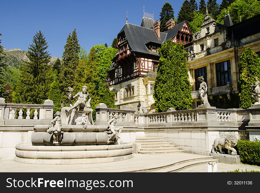 Peles castle in sinaia with the carpathian mountains in the background, romania