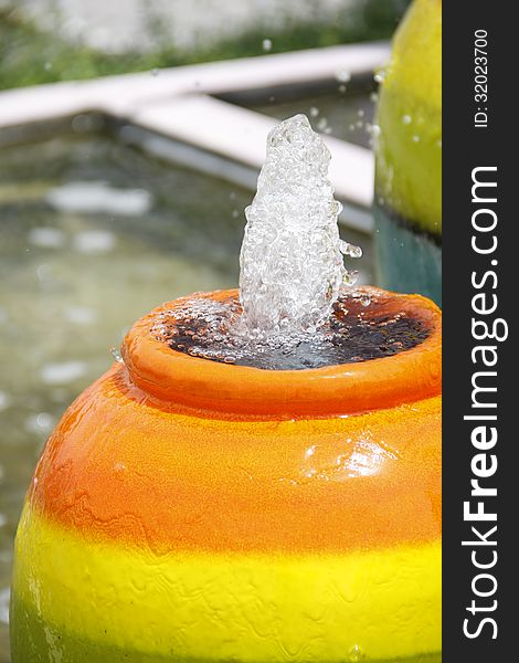 Colorful Jar fountain in the garden pool