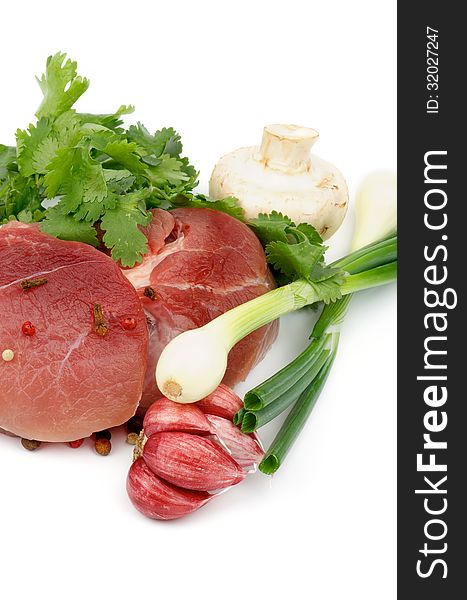 Perfect Boneless Raw Pork with Parsley, Spring Onion, Red Garlic, Edible Mushrooms and Spices isolated on white background