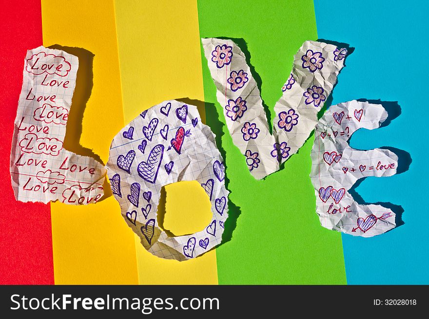 Colorful background of hand-made letters stacked in a word love