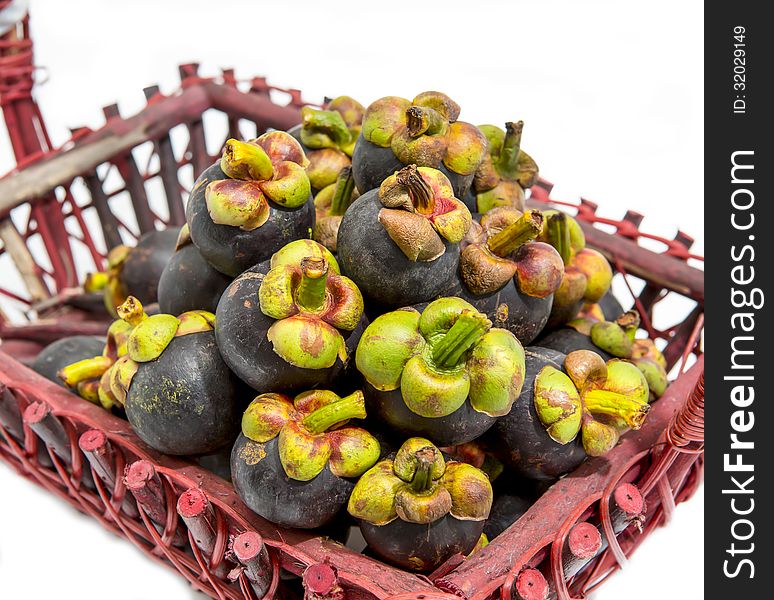 Mangosteen fruit in basket isolated and white background.