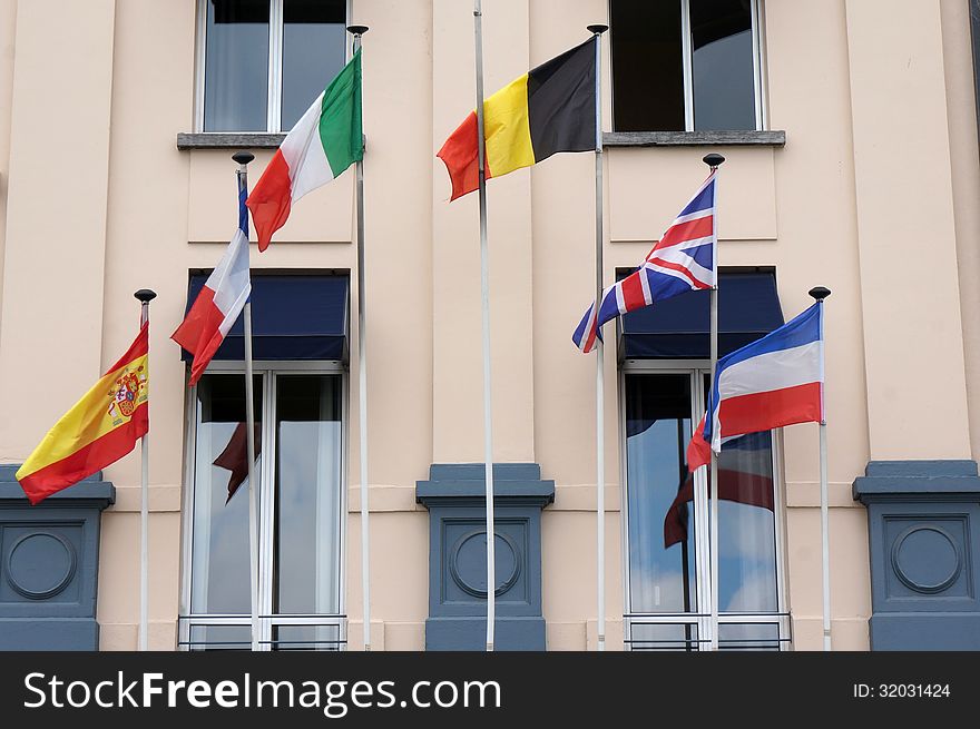 Facade of a hotel with flags.