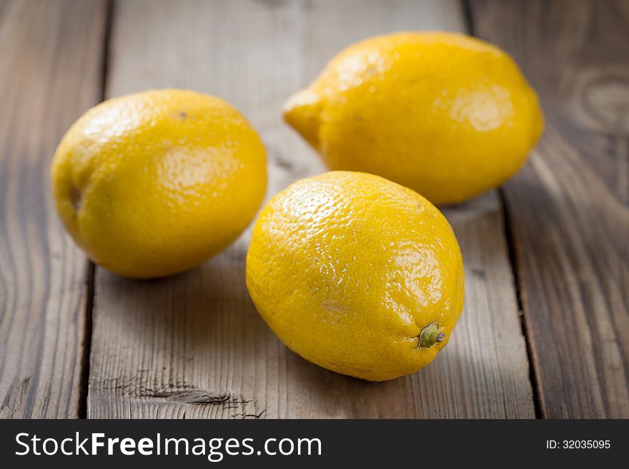 Fresh Lemons On Wooden Table