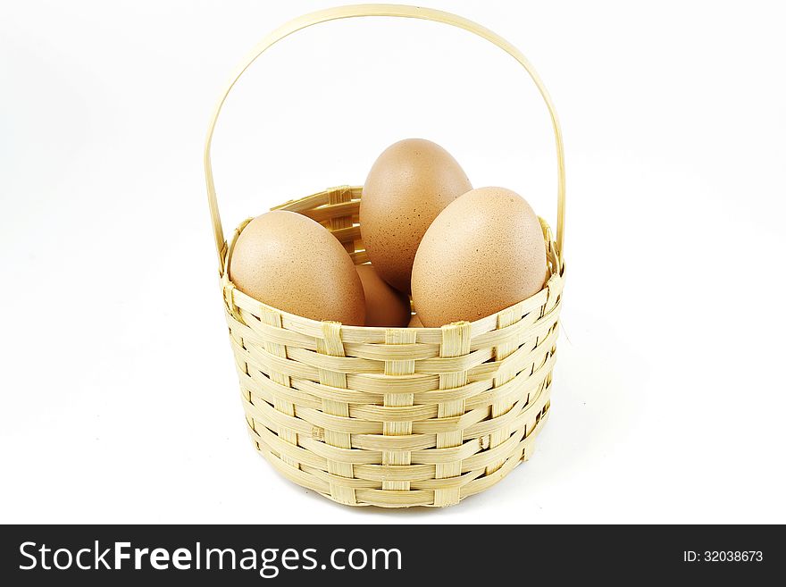Eggs in bamboo basket with white background