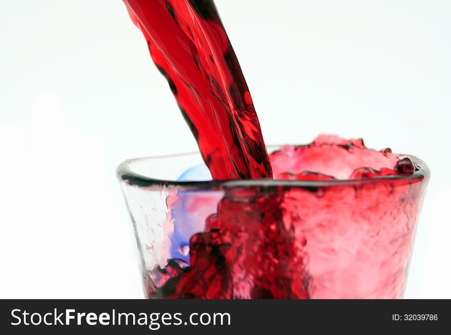 Pour red wine into glass. Pour red wine into glass