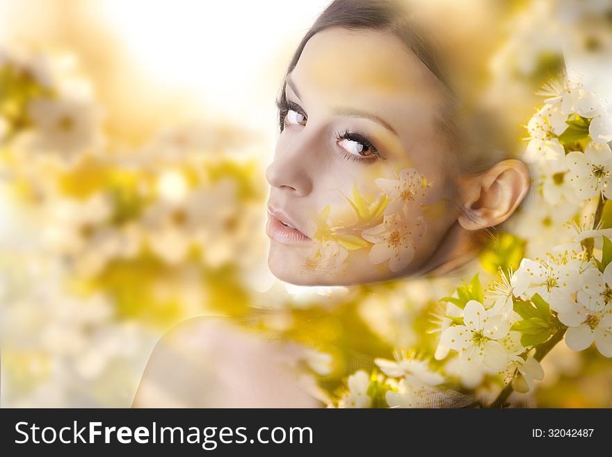 Pretty young woman portrait with white flowers