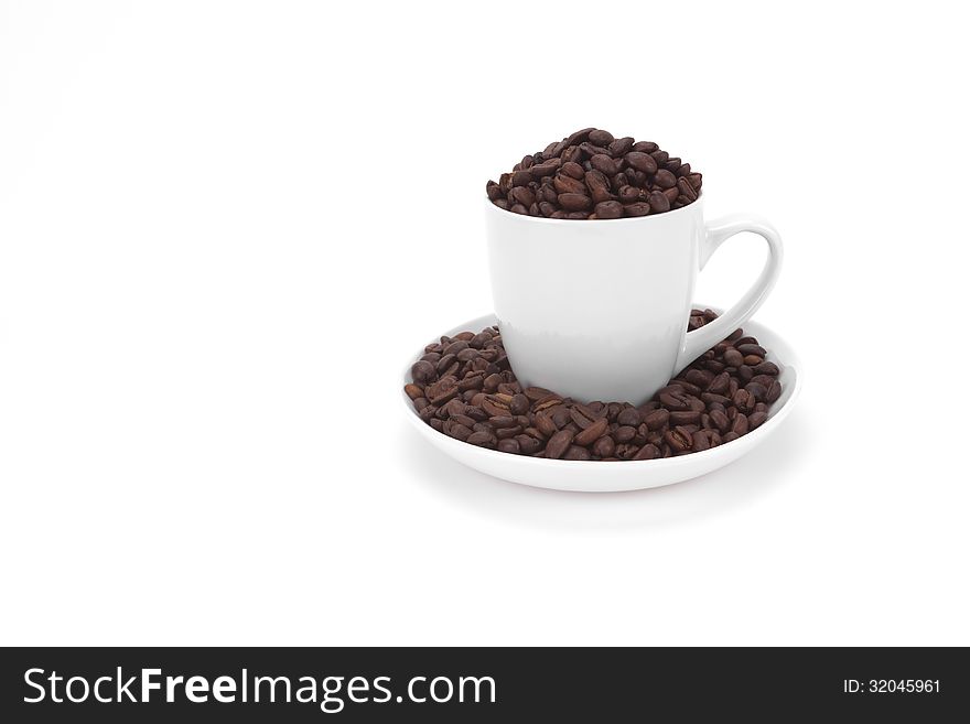 Coffee beans in a white cup