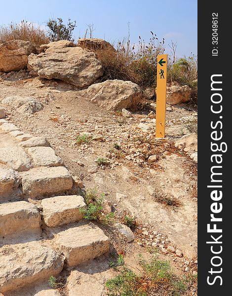 Sand stone ladder and movement directional marker in stone desert. Israel. Sand stone ladder and movement directional marker in stone desert. Israel.