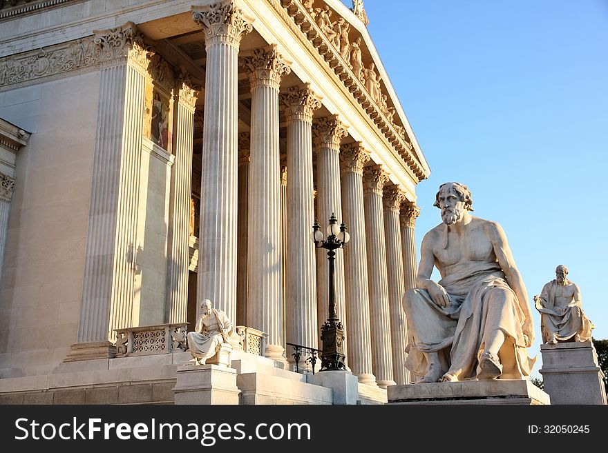 The Austrian Parliament with statue philosopher Thucydides in Vienna, Austria. The Austrian Parliament with statue philosopher Thucydides in Vienna, Austria