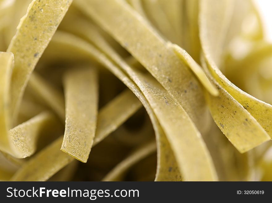 Tagliatelle paglia e fieno homemade tipycal italian pasta close-up. Tagliatelle paglia e fieno homemade tipycal italian pasta close-up