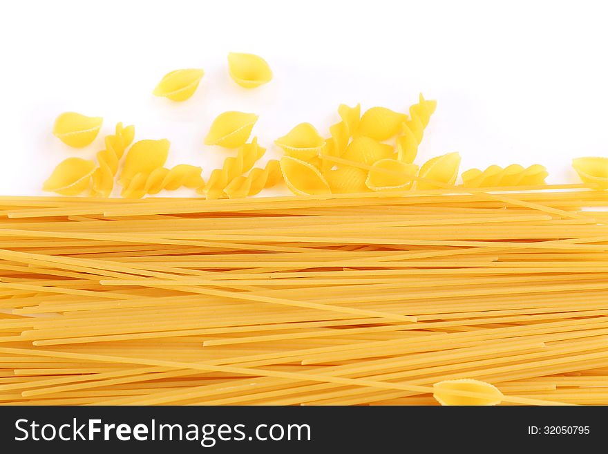 Frame of different pasta are located down on the white background