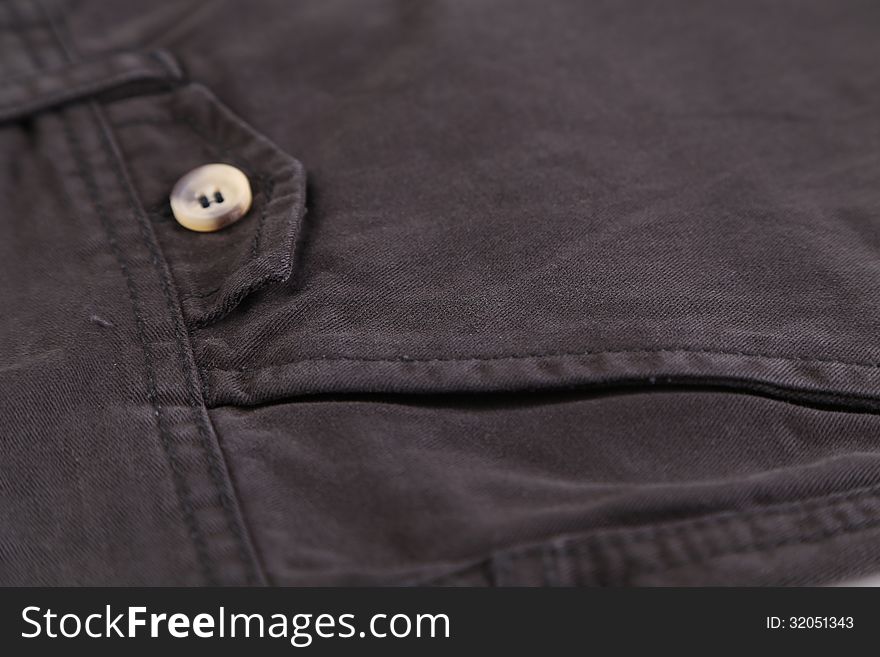 Side pocket classic black jeans. Closeup.