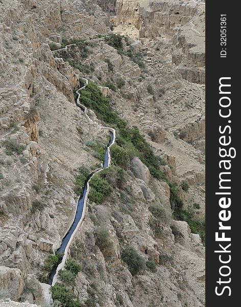 Ancient water conduit in wadi Qelt gorge, Judea desert in Israel. Ancient water conduit in wadi Qelt gorge, Judea desert in Israel.