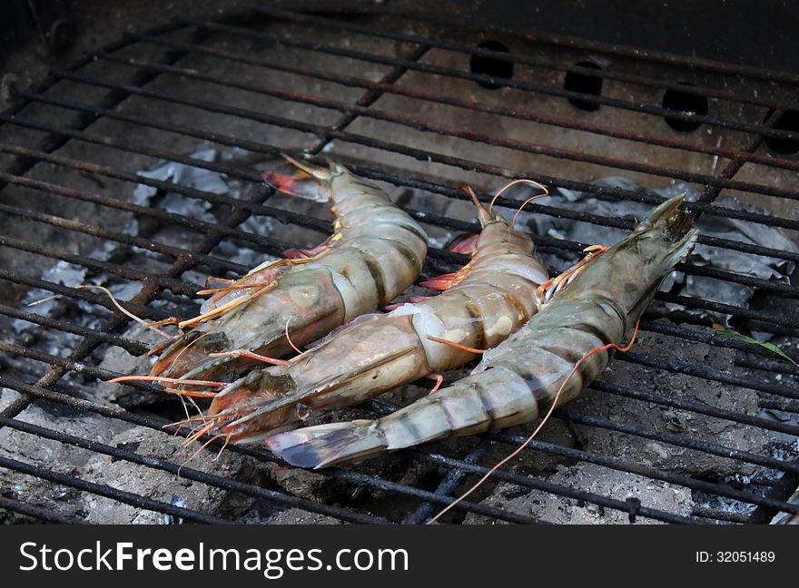 Cooking tiger prawns grilled. Close-up. Background. Outdoor.