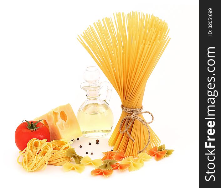 Different pasta, oil, tomato, cheese on a white background