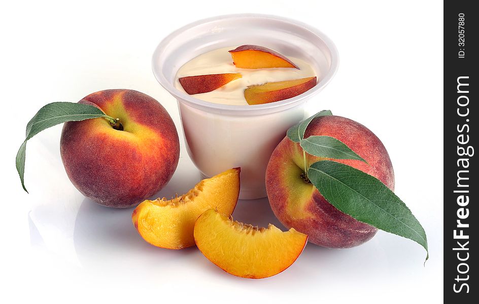 Yoghurt with peach and pieces on a white background