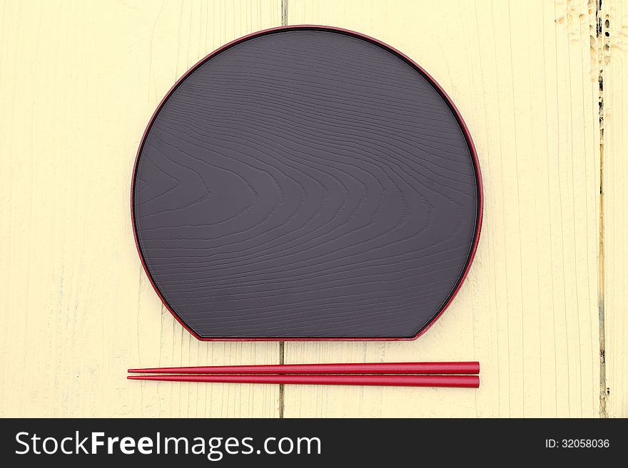 Plate and chopsticks with japanese style on wooden table