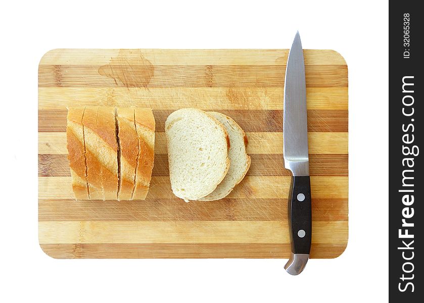 Sliced bread and kitchen knife on cutting board