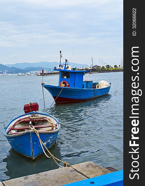 Blue fishing boat in the harbour of la spezia