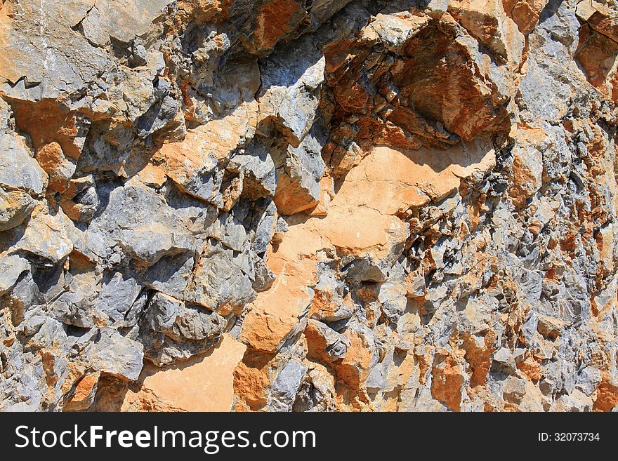 Rocky mountains - mountain wall stone background. Rocky mountains - mountain wall stone background