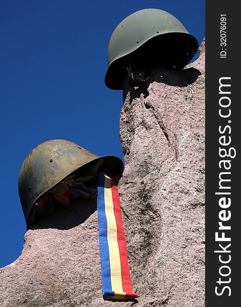 Monument of casualities of World War II with german and soviet helmet