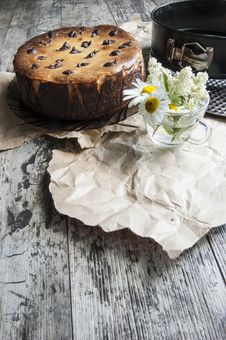 Cheesecake With A Bouquet Of Daisies. Vertical Shot. Stock Photography Cheesecake With A Bouquet Of Daisies. Vertical Shot. Stock Photography