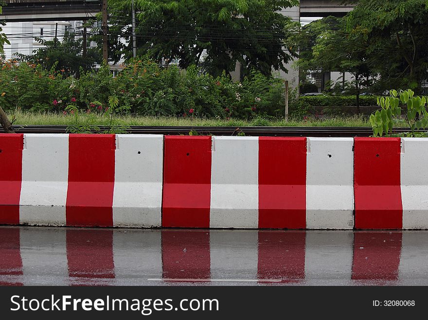 White and red color concrete barrier. White and red color concrete barrier