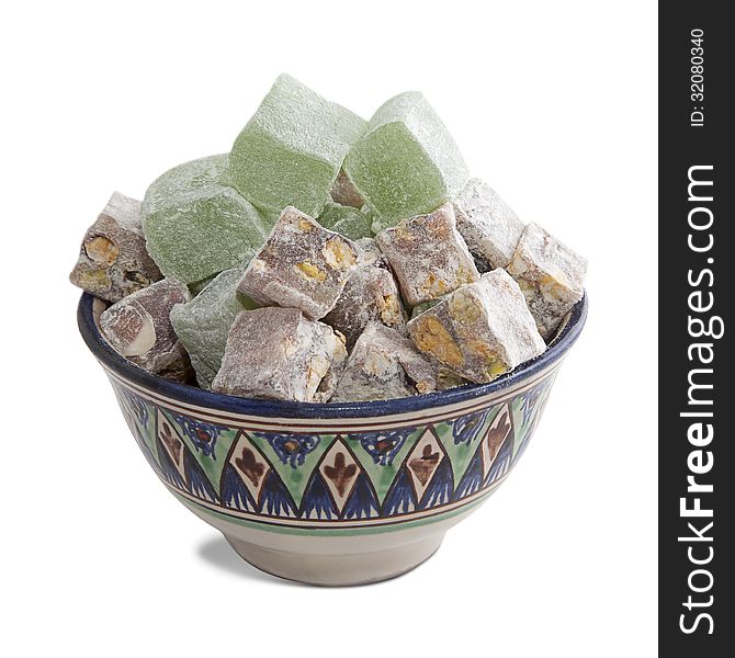 Bowl with turkish delight, isolated over white