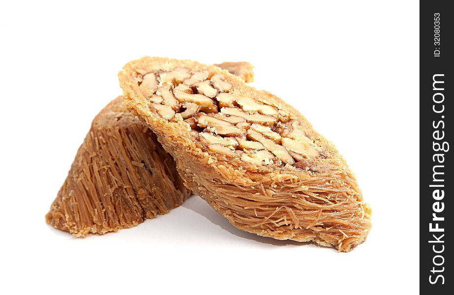 Two pieces of turkish baklava isolated over white background