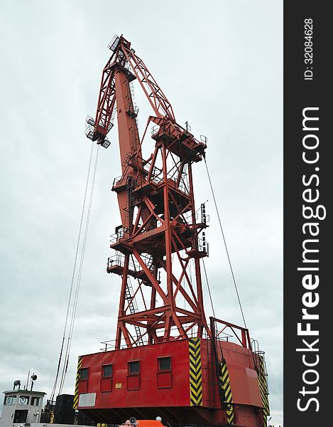 Big red sea port crane