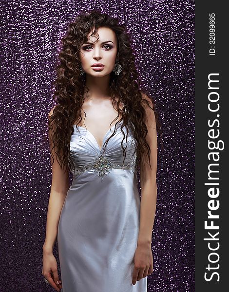 Sophistication. Glamor. Sensual Brunette With Waved Hairs And Silk Blue Dress