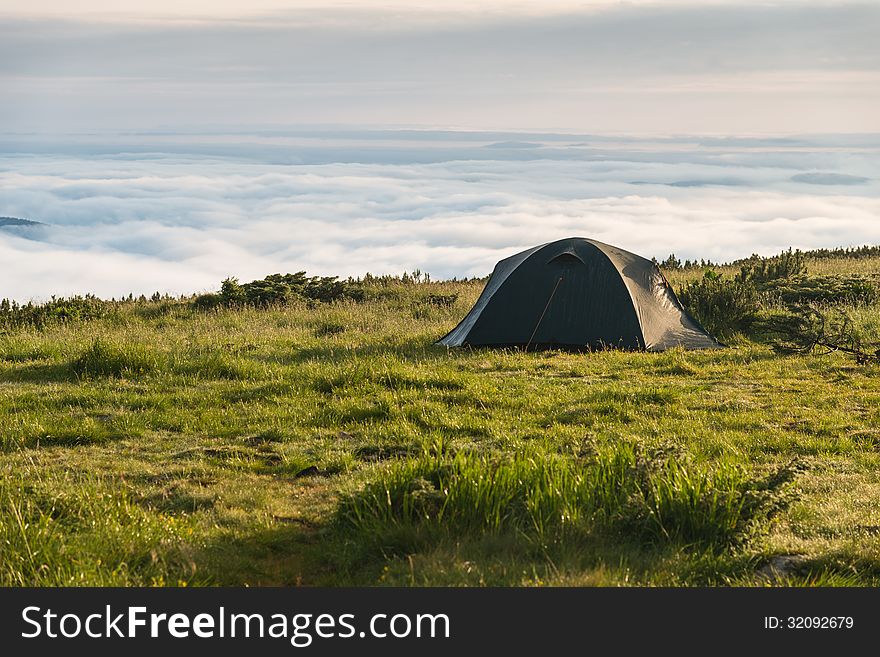 Tent in mountains above the clouds. Tent in mountains above the clouds