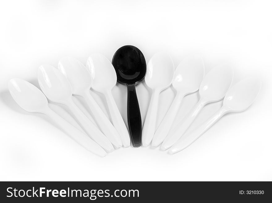 Black and white plastic spoons