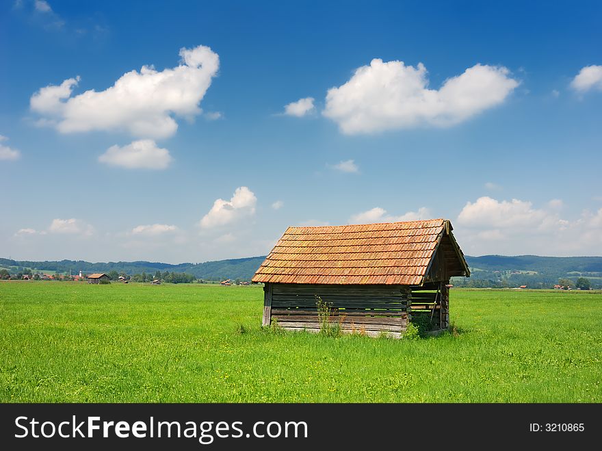 Bavarian hut horizontal on green meadow