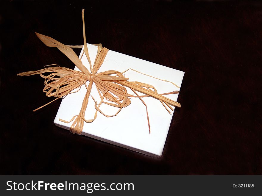 White Gift Box tied with a Straw Bow. White Gift Box tied with a Straw Bow
