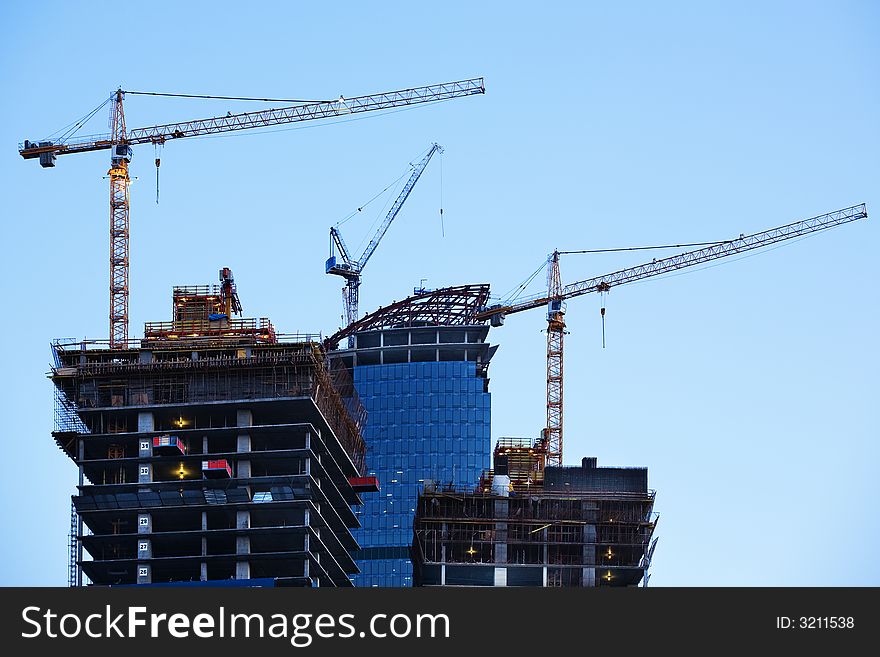 Construction of a skyscraper in Moscow, early morning. Construction of a skyscraper in Moscow, early morning