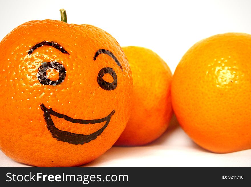 A photo of oranges with a drawn face. A photo of oranges with a drawn face.