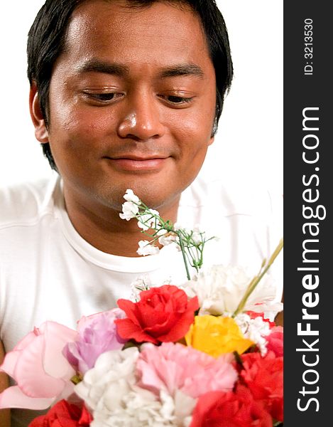 Handsome man is holding a bunch of flowers. Handsome man is holding a bunch of flowers