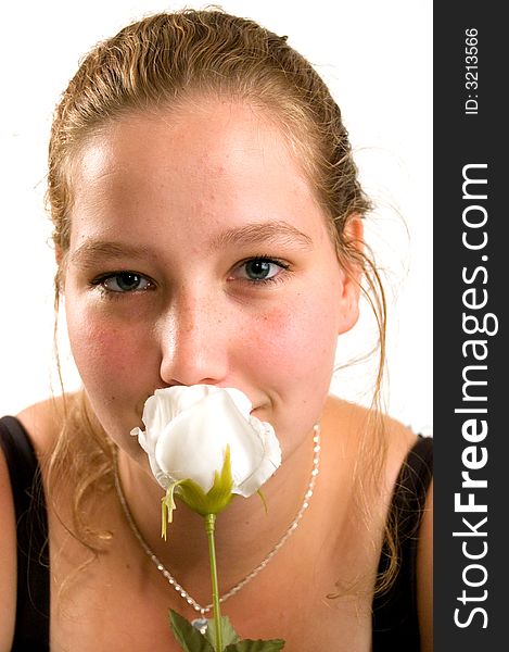 Young woman is holding a white rose. Young woman is holding a white rose